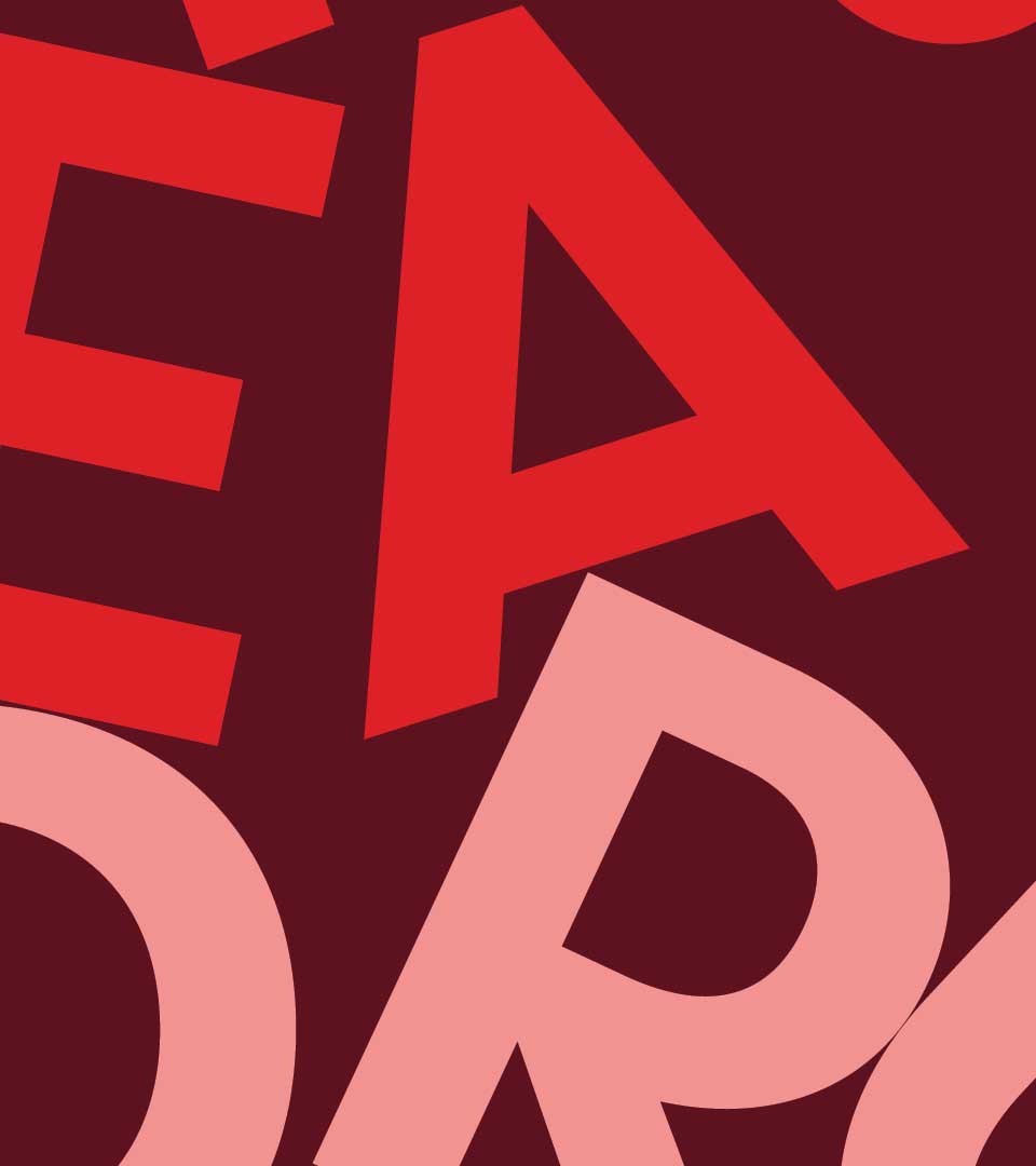 Sample design: Red and pink letterforms on a burgundy background